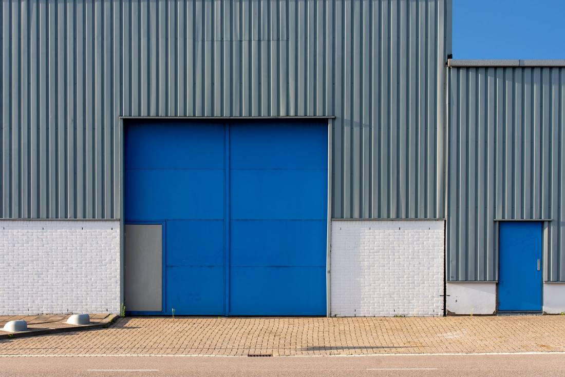 A distribution center with rooftop units along the roofline.